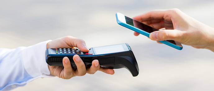 A person makes a payment with his smartphone